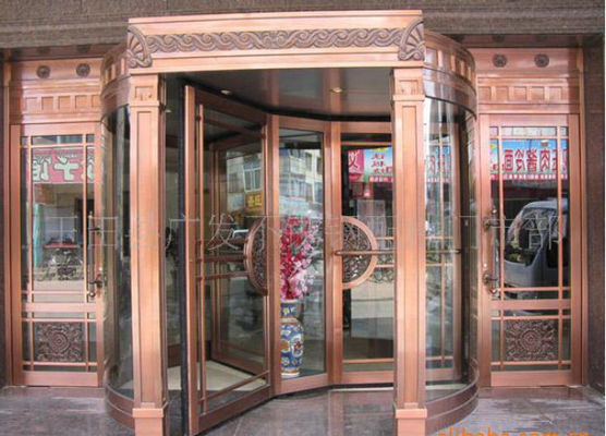 Cina Bronze Engraving Flower Hotel entrance automatic revolving door OEM service pabrik